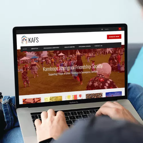 The homepage of the KAFS website seen on the screen of a laptop