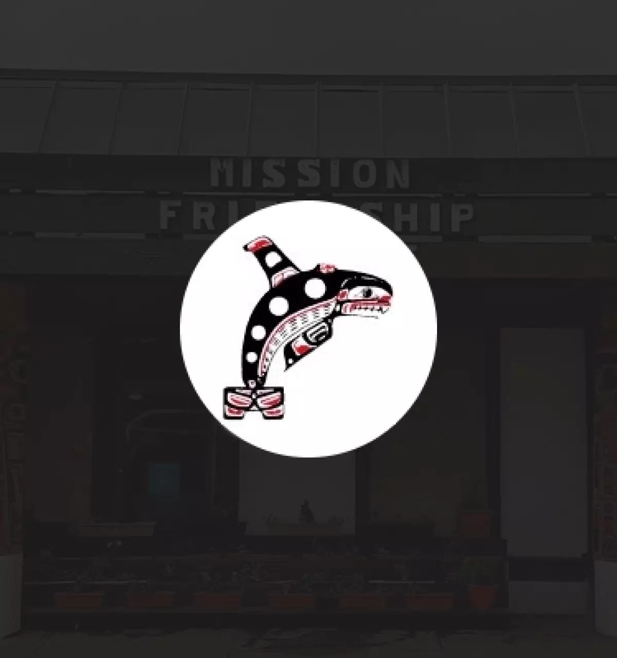 Mission Friendship Centre logo button over top of an image of the centre